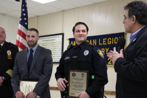 Utica Mayor Robert Palmieri (right) praises Investigator Paul Paladino (left( and Officer John Scaramuzzino.
