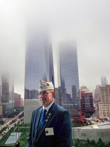 Commander Schacher, overlooking the new World Trade Center buildings and 9/11 Memorial.