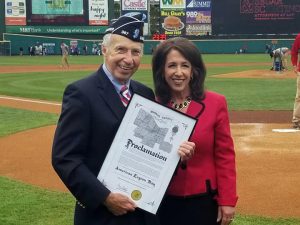 Monroe County American Legion Vice Commander Charles Clark receives proclamation from Monroe County Executive Cheryl Dinolfo at the Rochester Red Wings basebll game